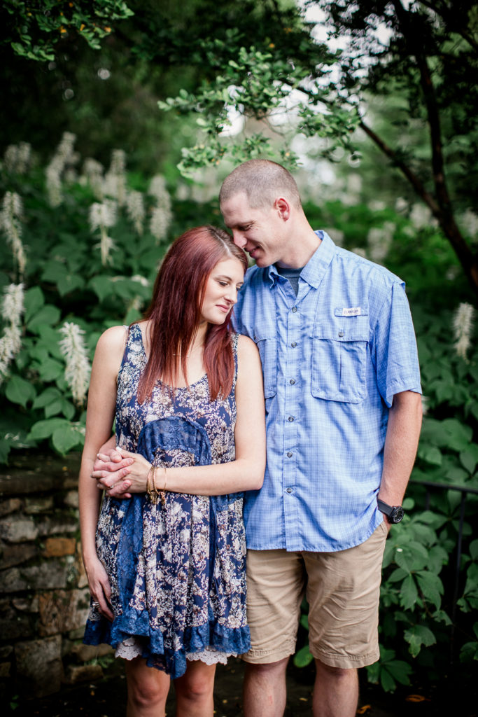 His hand on her hip at this Knoxville Botanical Gardens engagement session by Knoxville Wedding Photographer, Amanda May Photos.