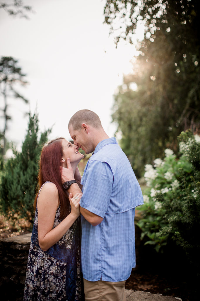 His hand on her neck at this Knoxville Botanical Gardens engagement session by Knoxville Wedding Photographer, Amanda May Photos.