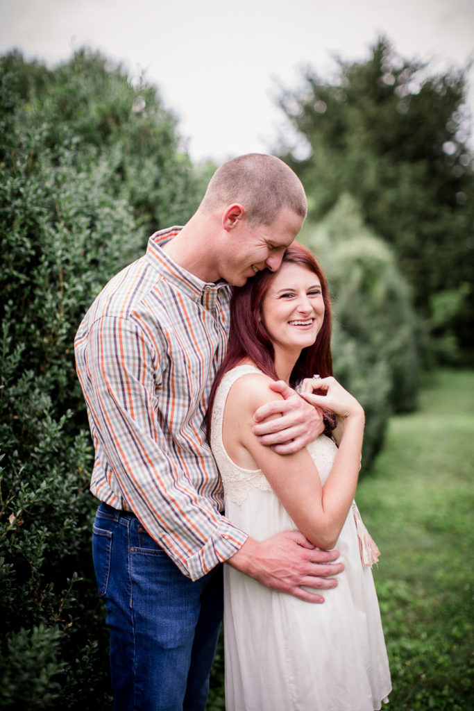 Wrapped around her shoulders at this Knoxville Botanical Gardens engagement session by Knoxville Wedding Photographer, Amanda May Photos.