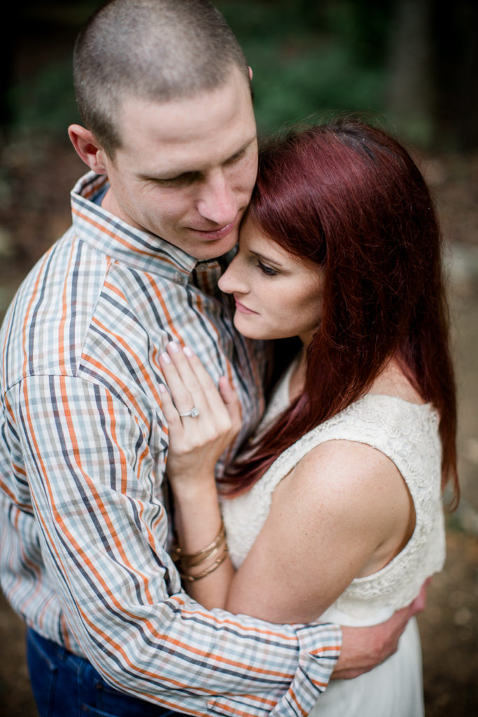Her hand on his chest at this Knoxville Botanical Gardens engagement session by Knoxville Wedding Photographer, Amanda May Photos.