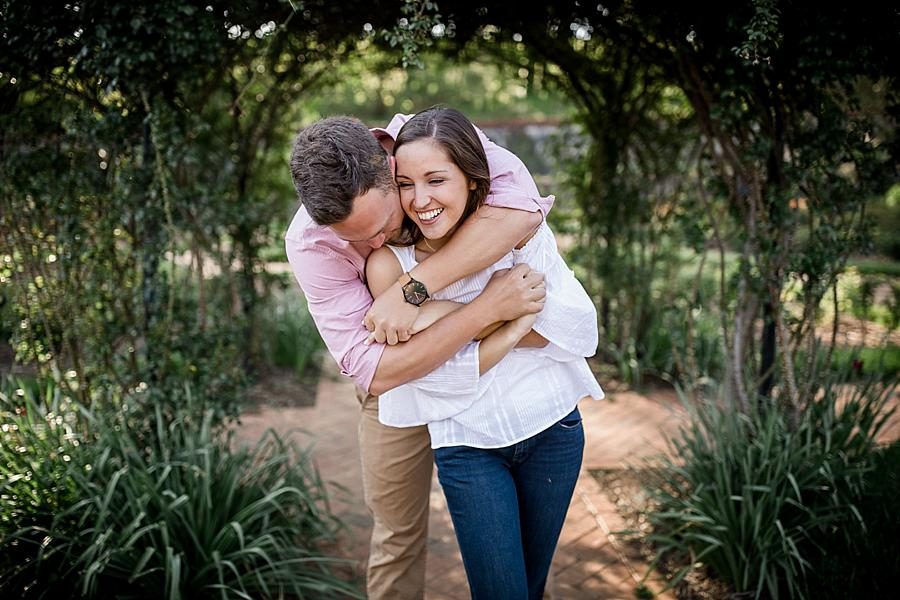 Hug from behind at this Biltmore Engagement by Knoxville Wedding Photographer, Amanda May Photos.