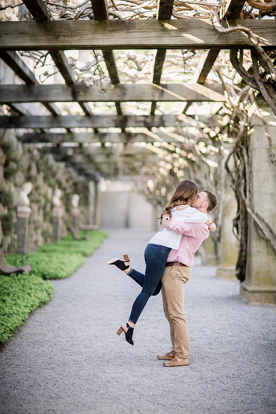 Hug and kiss at this Biltmore Engagement by Knoxville Wedding Photographer, Amanda May Photos.