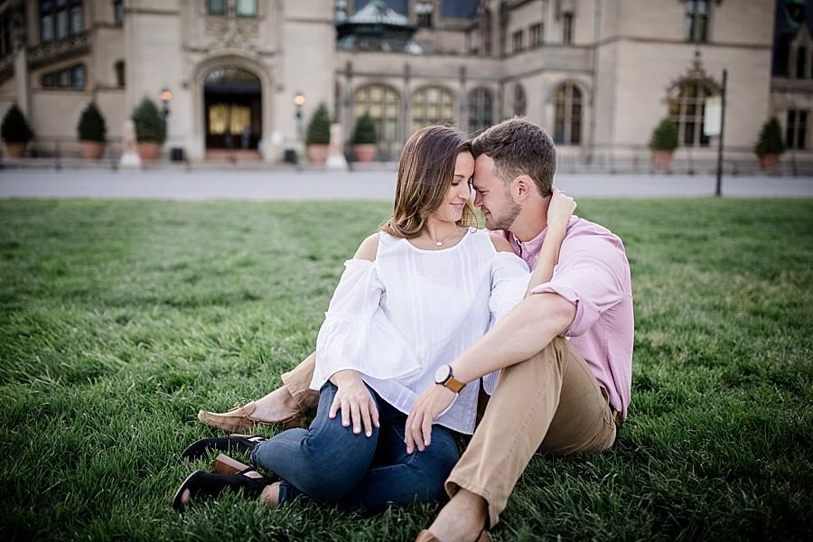 Sitting on the lawn at this Biltmore Engagement by Knoxville Wedding Photographer, Amanda May Photos.