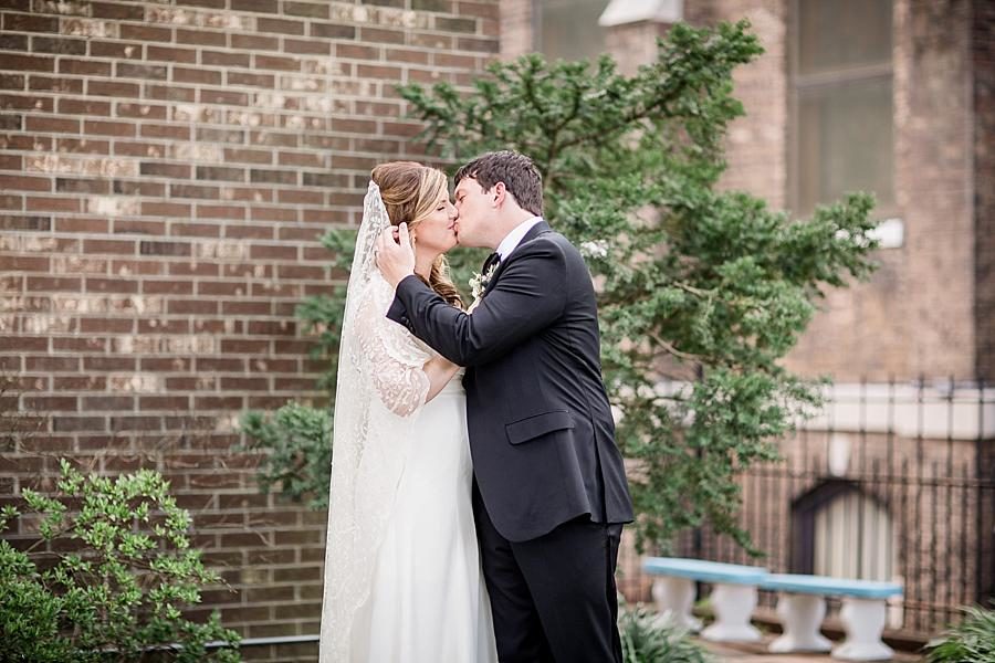 Kisses at this Southern Railway Station Wedding by Knoxville Wedding Photographer, Amanda May Photos.