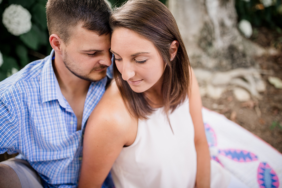 Looking down at couple forehead to forehead at this Estate of Grace engagement session by Knoxville Wedding Photographer, Amanda May Photos.