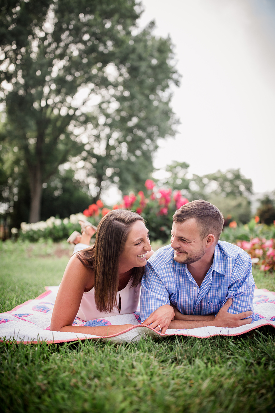 Laughing on blanket at this Estate of Grace engagement session by Knoxville Wedding Photographer, Amanda May Photos.