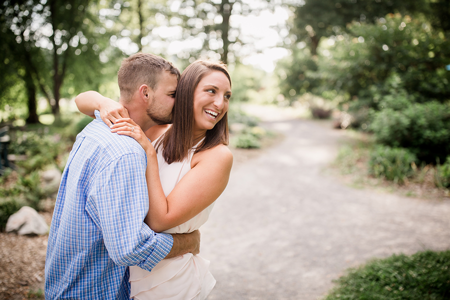 Kissing her neck while she laughs at this Estate of Grace engagement session by Knoxville Wedding Photographer, Amanda May Photos.