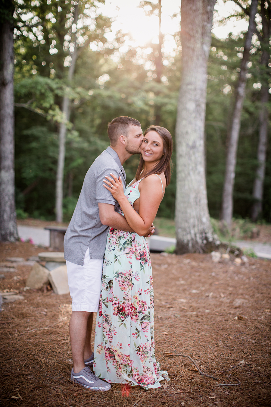 Kissing her cheek at this Estate of Grace engagement session by Knoxville Wedding Photographer, Amanda May Photos.