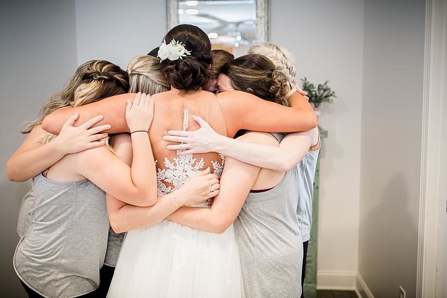 Bridesmaids and bride hug at this Estate of Grace Wedding by Knoxville Wedding Photographer, Amanda May Photos.