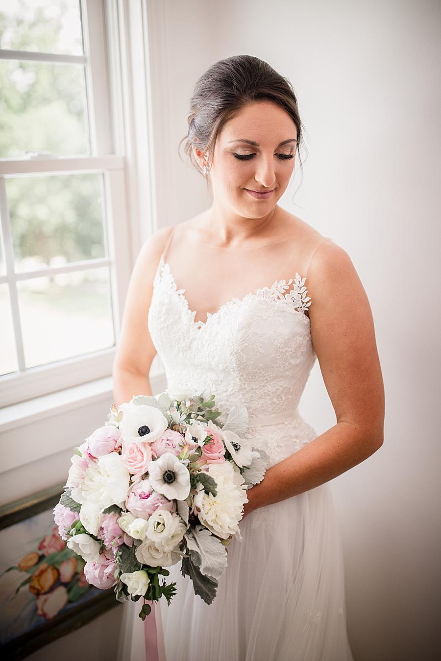 Holding the bouquet at this Estate of Grace Wedding by Knoxville Wedding Photographer, Amanda May Photos.