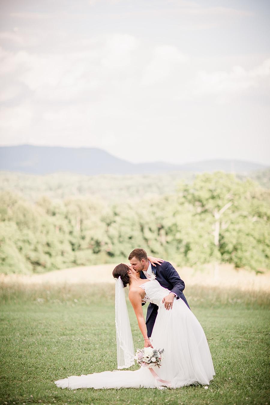 Dip kiss at this Estate of Grace Wedding by Knoxville Wedding Photographer, Amanda May Photos.