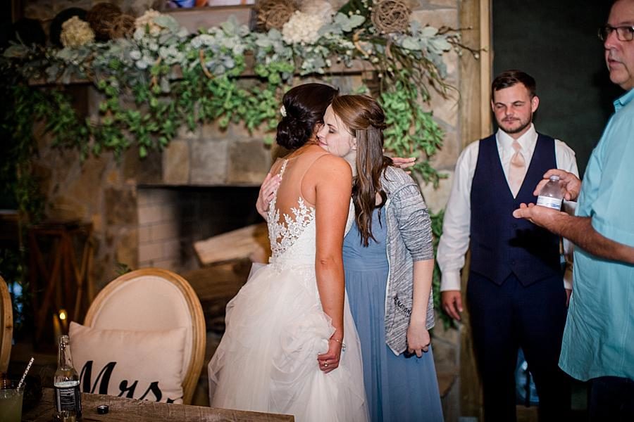 Hugging guests at this Estate of Grace Wedding by Knoxville Wedding Photographer, Amanda May Photos.