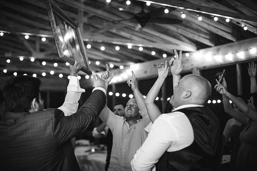 Raising up a photo at this Estate of Grace Wedding by Knoxville Wedding Photographer, Amanda May Photos.