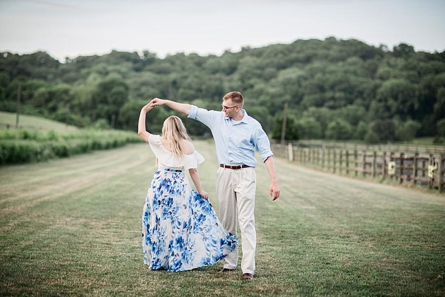 Pasture twirl at this Percy Warner Engagement Session by Knoxville Wedding Photographer, Amanda May Photos.