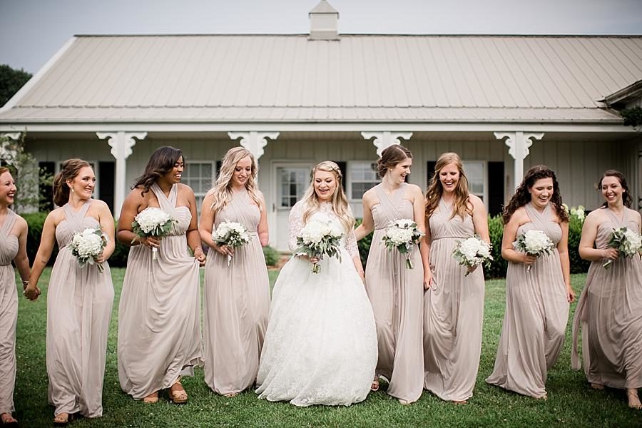 Walking and laughing at this Cheval Manor Wedding by Knoxville Wedding Photographer, Amanda May Photos.