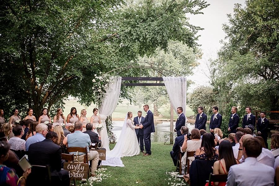 Under the arch at this Cheval Manor Wedding by Knoxville Wedding Photographer, Amanda May Photos.