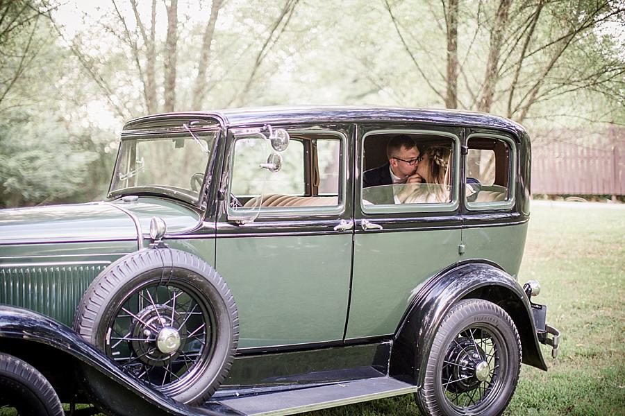Kisses in the backseat at this Cheval Manor Wedding by Knoxville Wedding Photographer, Amanda May Photos.