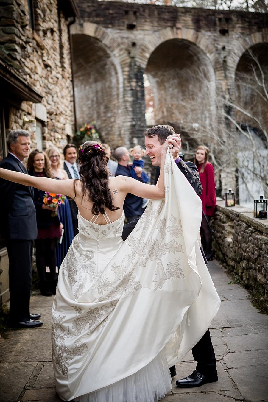 Twirling the bride during the first dance at this Cumberland Mountain State Park wedding by Knoxville Wedding Photographer, Amanda May Photos.
