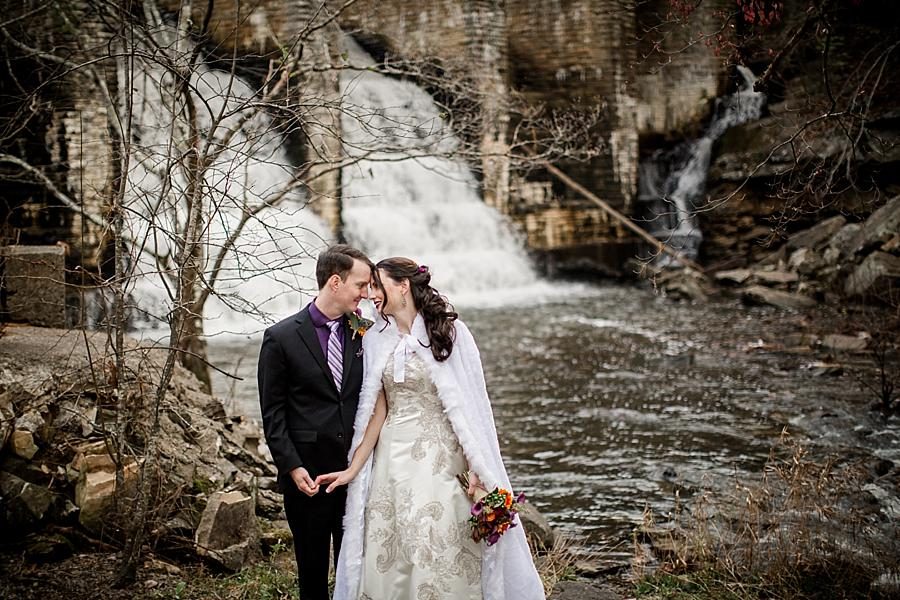 Hands and foreheads in front of waterfalls at this Cumberland Mountain State Park wedding by Knoxville Wedding Photographer, Amanda May Photos.