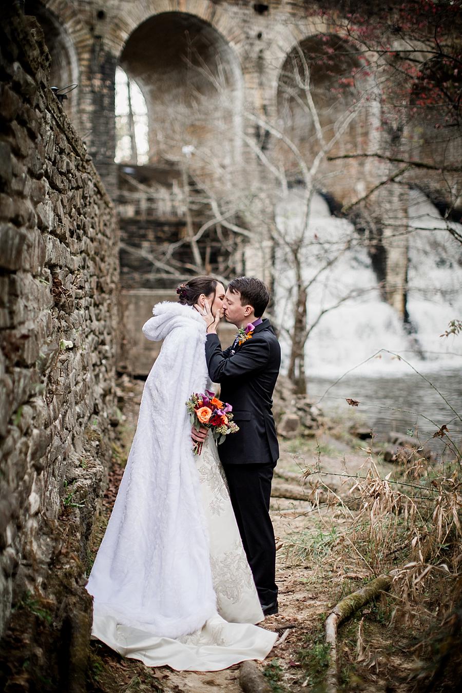 Groom's hands on bride's cheeks kissing her slowly at this Cumberland Mountain State Park wedding by Knoxville Wedding Photographer, Amanda May Photos.