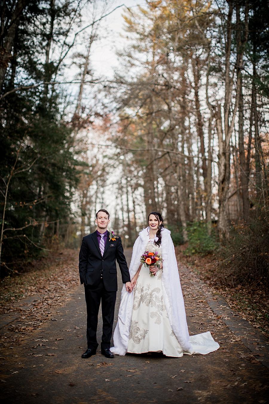 Holding hands facing the camera at this Cumberland Mountain State Park wedding by Knoxville Wedding Photographer, Amanda May Photos.