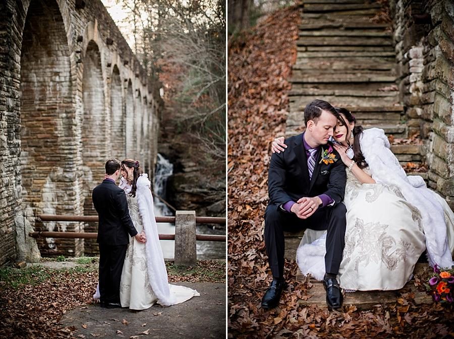 Sitting on the stone stairs snuggling at this Cumberland Mountain State Park wedding by Knoxville Wedding Photographer, Amanda May Photos.