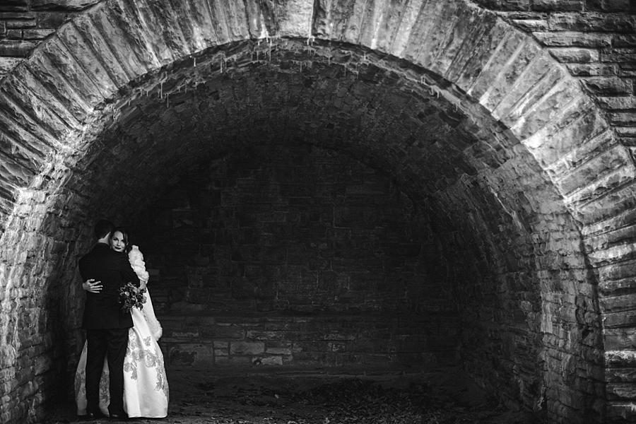Standing under the arches in black and white at this Cumberland Mountain State Park wedding by Knoxville Wedding Photographer, Amanda May Photos.