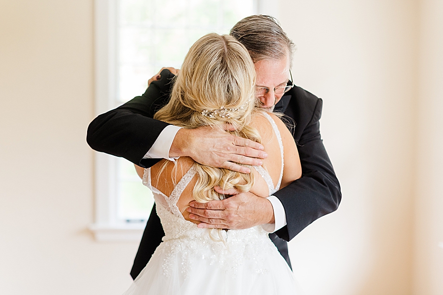 bride hugging dad at this kincaid house wedding