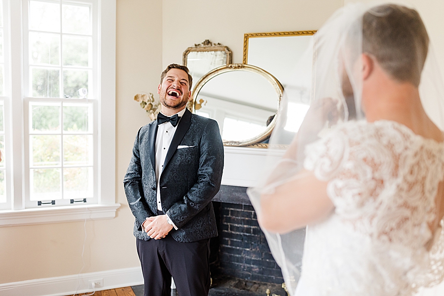 groom laughing at this kincaid house wedding