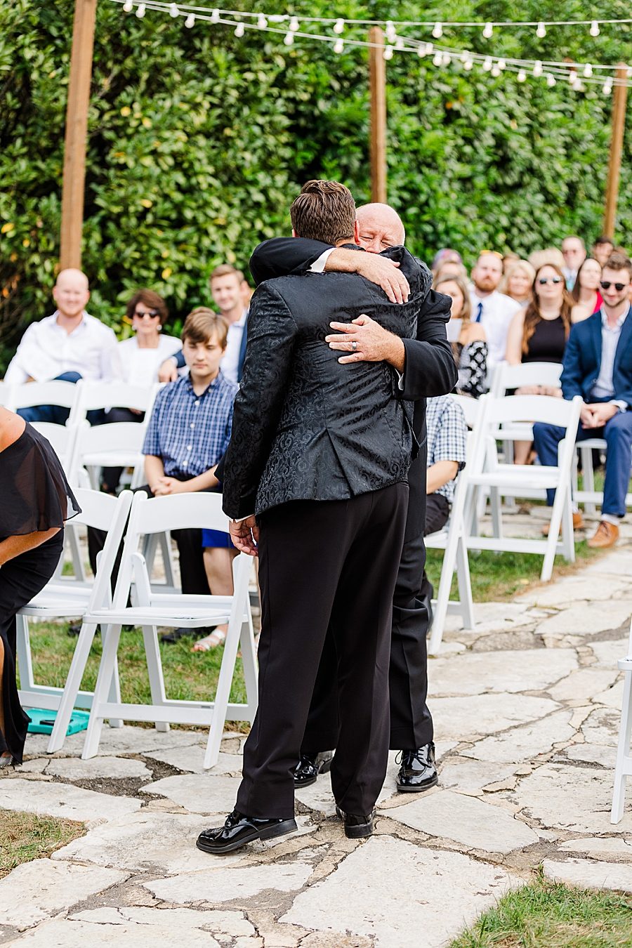 groom hugging dad at this kincaid house wedding