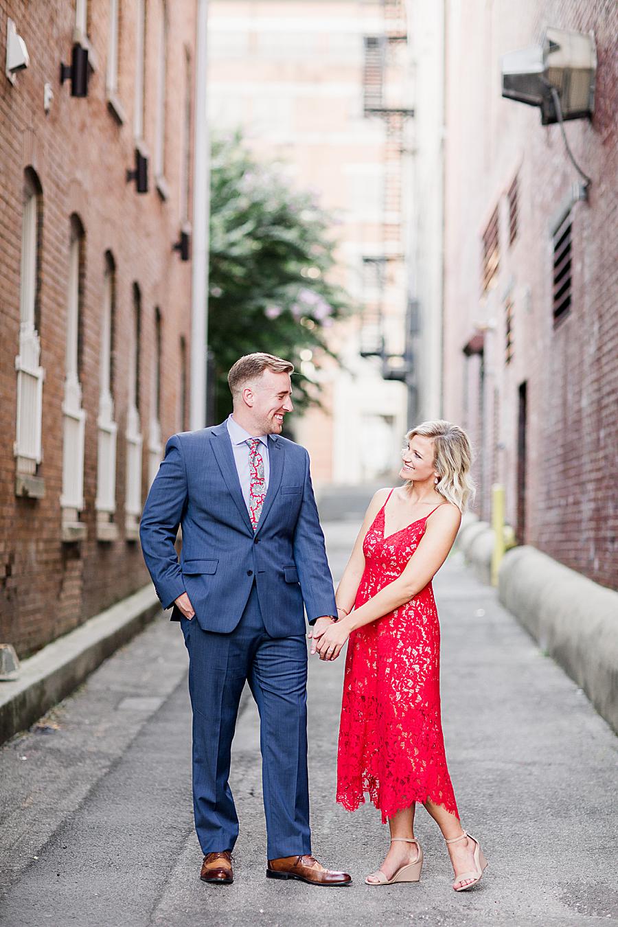 Holding hands at this Knoxville Botanical Gardens engagement by Knoxville Wedding Photographer, Amanda May Photos.