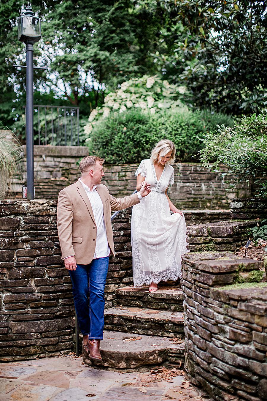Walking down stone stairs at this Knoxville Botanical Gardens engagement by Knoxville Wedding Photographer, Amanda May Photos.