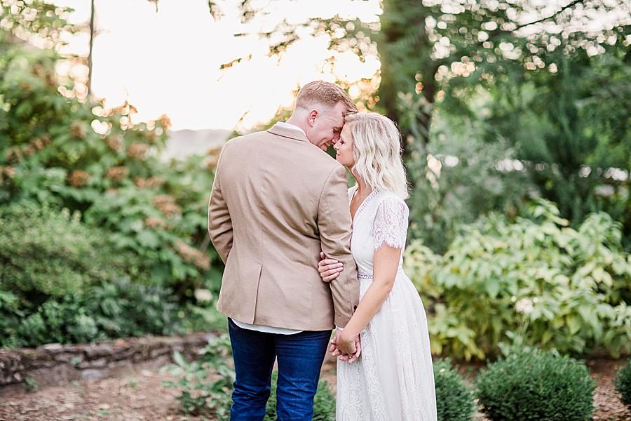 Foreheads together at this Knoxville Botanical Gardens engagement by Knoxville Wedding Photographer, Amanda May Photos.