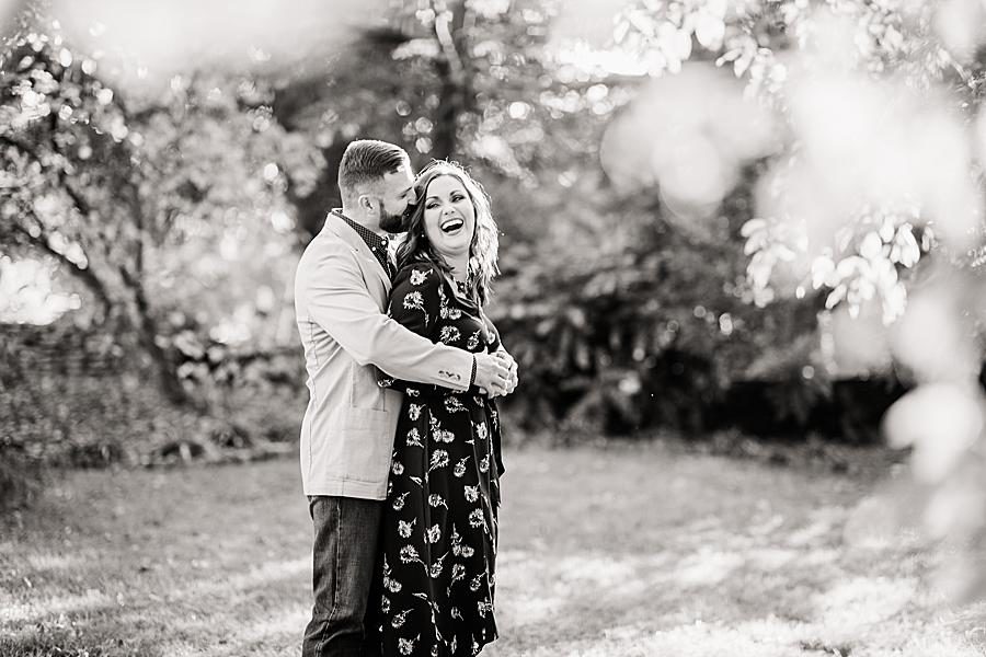 Hug from behind at this Knoxville Botanical Gardens Engagement by Knoxville Wedding Photographer, Amanda May Photos.