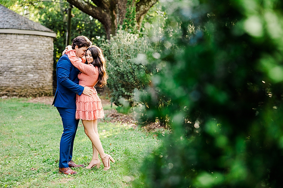 arms around neck at knoxville botanical garden engagement