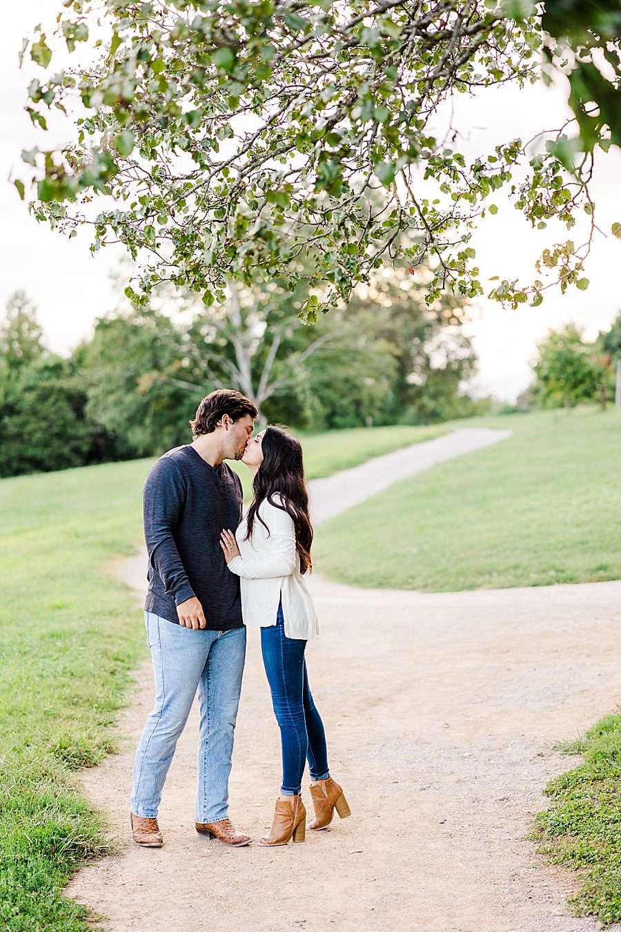 couple kissing at knoxville botanical garden engagement