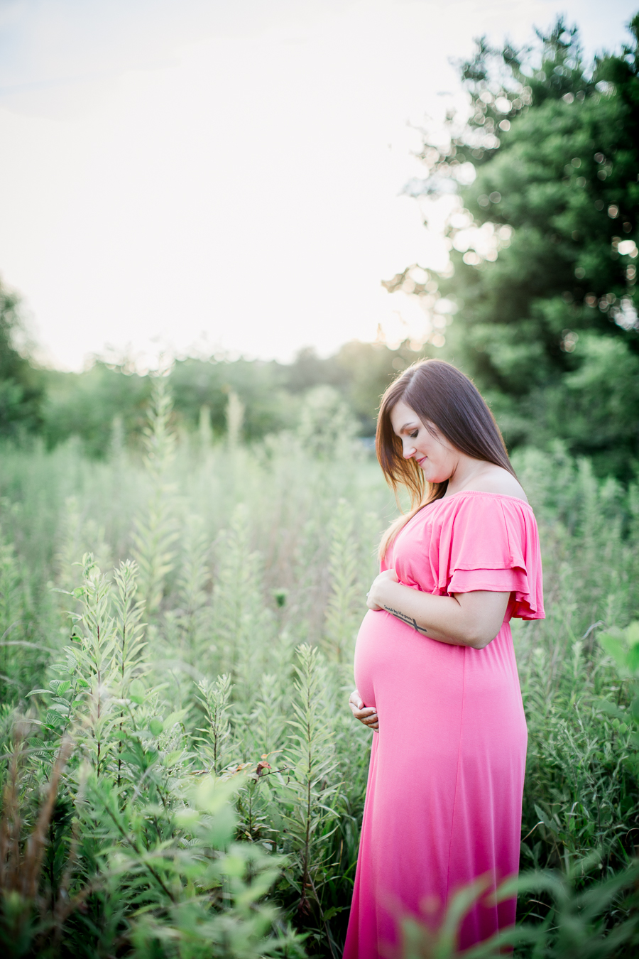 Looking down at her belly at this Sterchi Hills maternity session by Knoxville Wedding Photographer, Amanda May Photos.