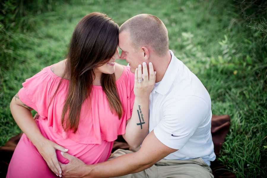 Her hand on his cheek at this Sterchi Hills maternity session by Knoxville Wedding Photographer, Amanda May Photos.