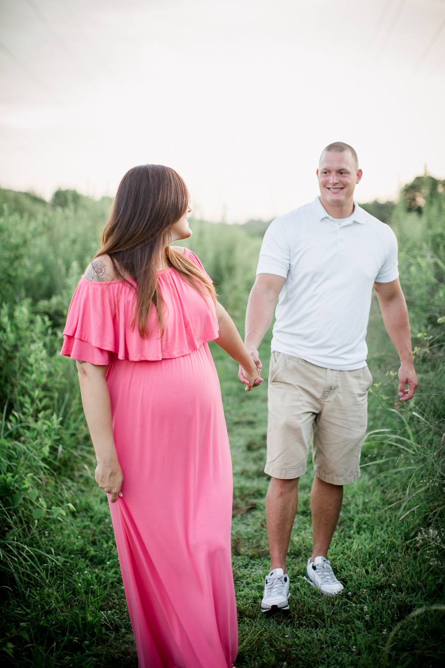 Walking hand in hand at this Sterchi Hills maternity session by Knoxville Wedding Photographer, Amanda May Photos.