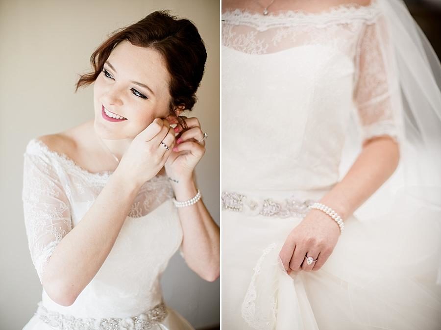Putting in earrings at this Colorado Destination Wedding by Knoxville Wedding Photographer, Amanda May Photos.