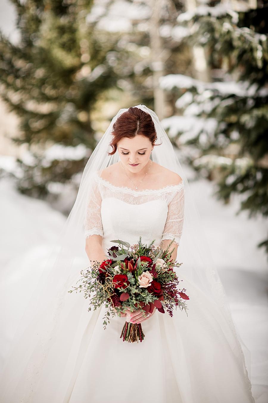 Looking at the bouquet at this Colorado Destination Wedding by Knoxville Wedding Photographer, Amanda May Photos.
