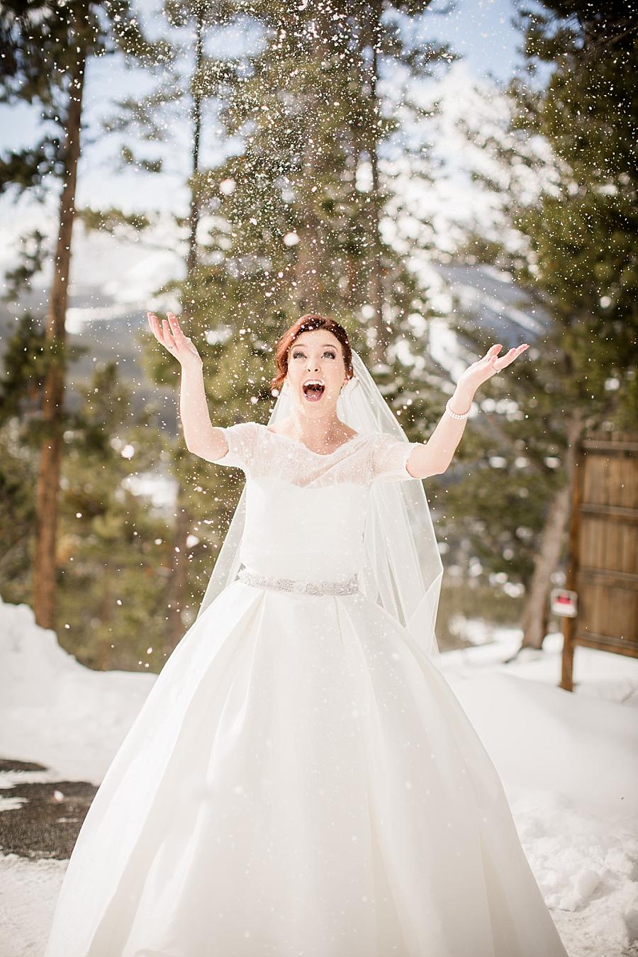 Tossing snow at this Colorado Destination Wedding by Knoxville Wedding Photographer, Amanda May Photos.