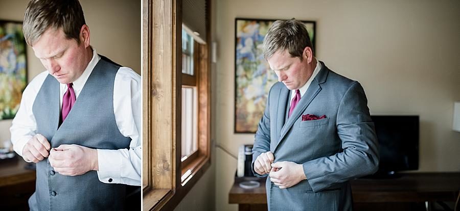 Buttoning the jacket at this Colorado Destination Wedding by Knoxville Wedding Photographer, Amanda May Photos.