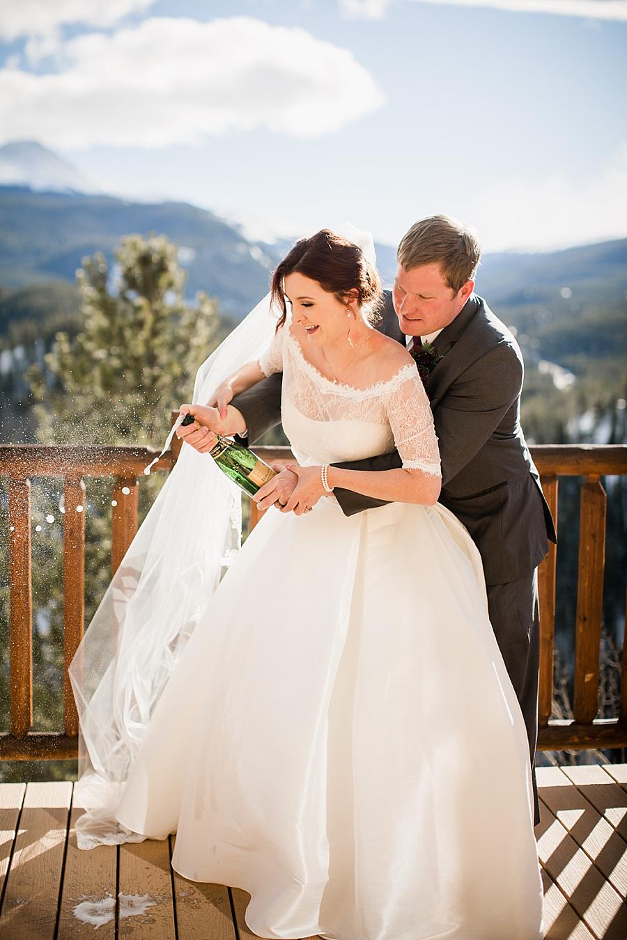 Popping champagne at this Colorado Destination Wedding by Knoxville Wedding Photographer, Amanda May Photos.