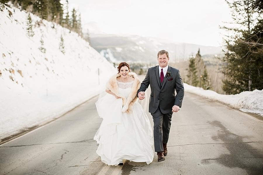 Walking down the road at this Colorado Destination Wedding by Knoxville Wedding Photographer, Amanda May Photos.