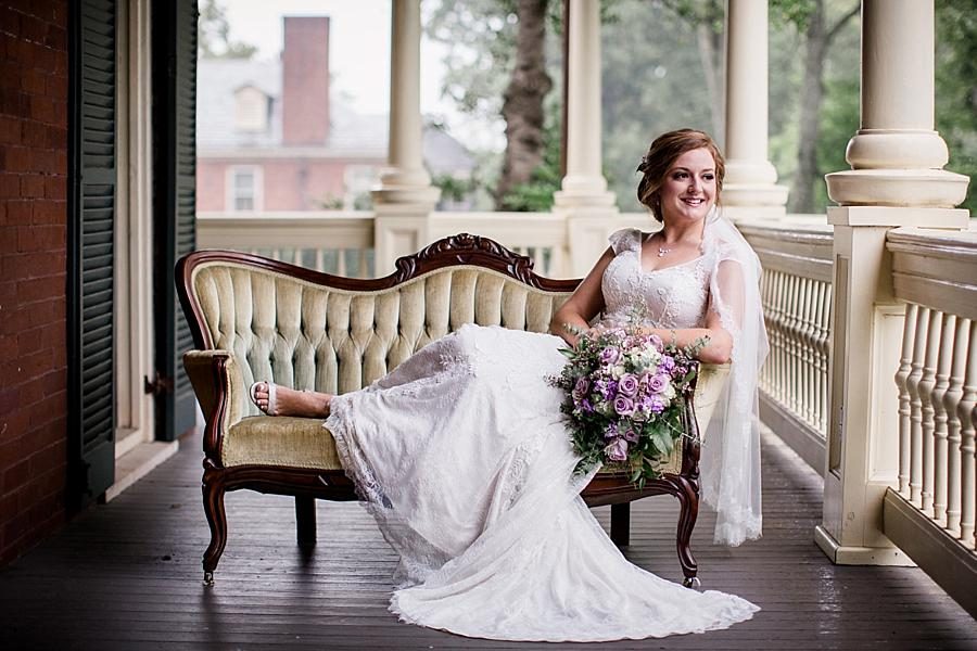 Bride sitting on couch at this Historic Westwood Bridal session by Knoxville Wedding Photographer, Amanda May Photos.