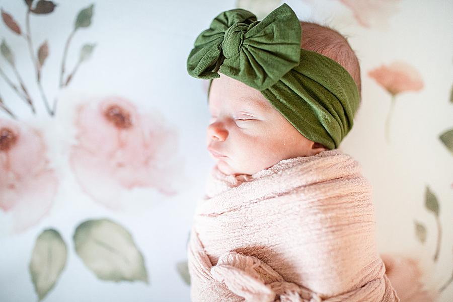 Green bow headband at this lifestyle newborn by Knoxville Wedding Photographer, Amanda May Photos.