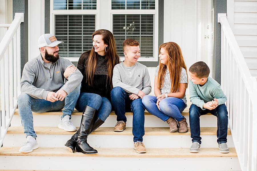 Family sitting together at this lifestyle session by Knoxville Wedding Photographer, Amanda May Photos.