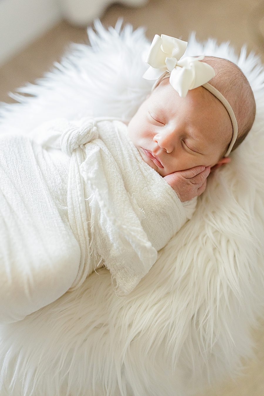hand on cheek at this lifestyle newborn session