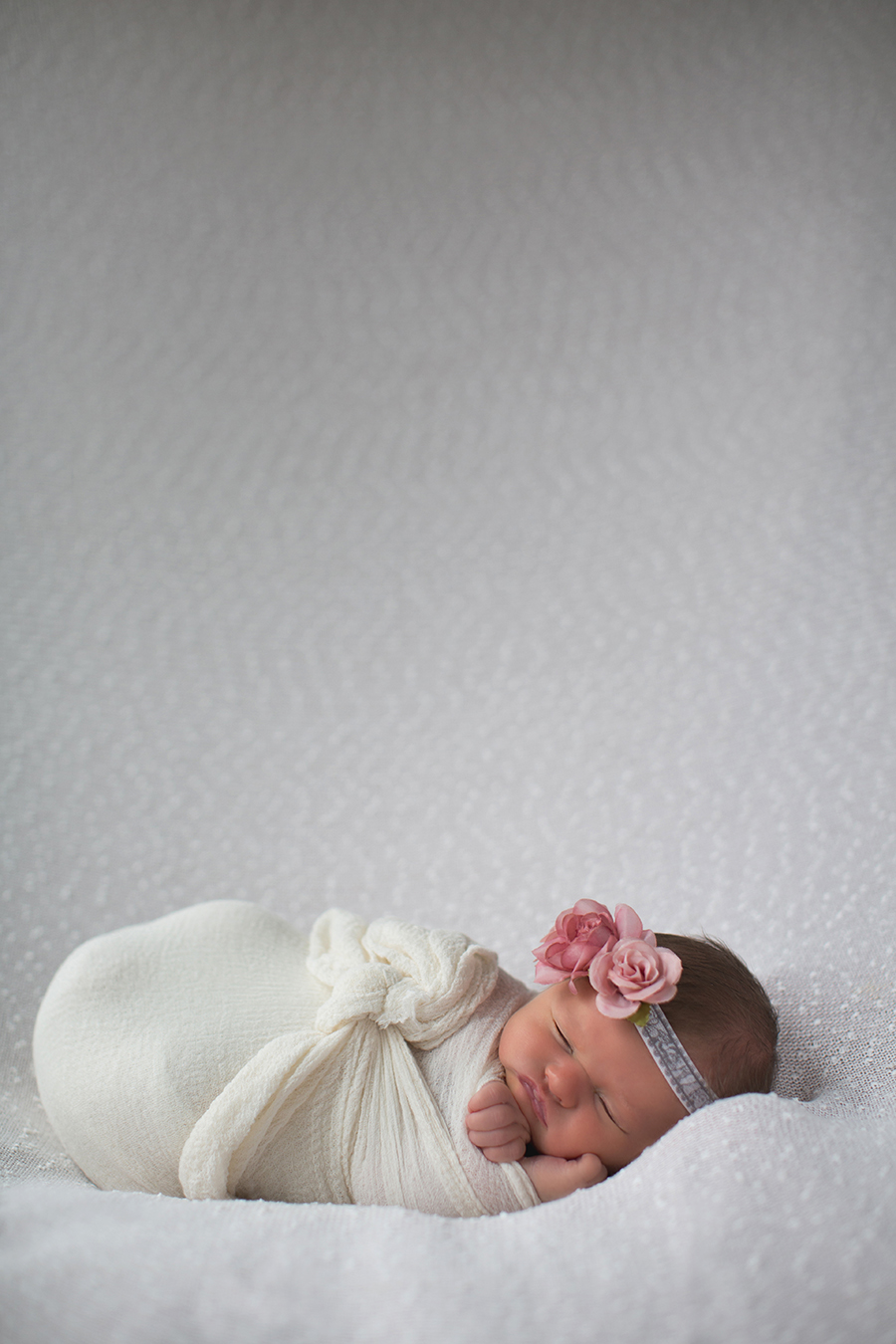 Pink flower headband at this newborn session by Knoxville Wedding Photographer, Amanda May Photos.